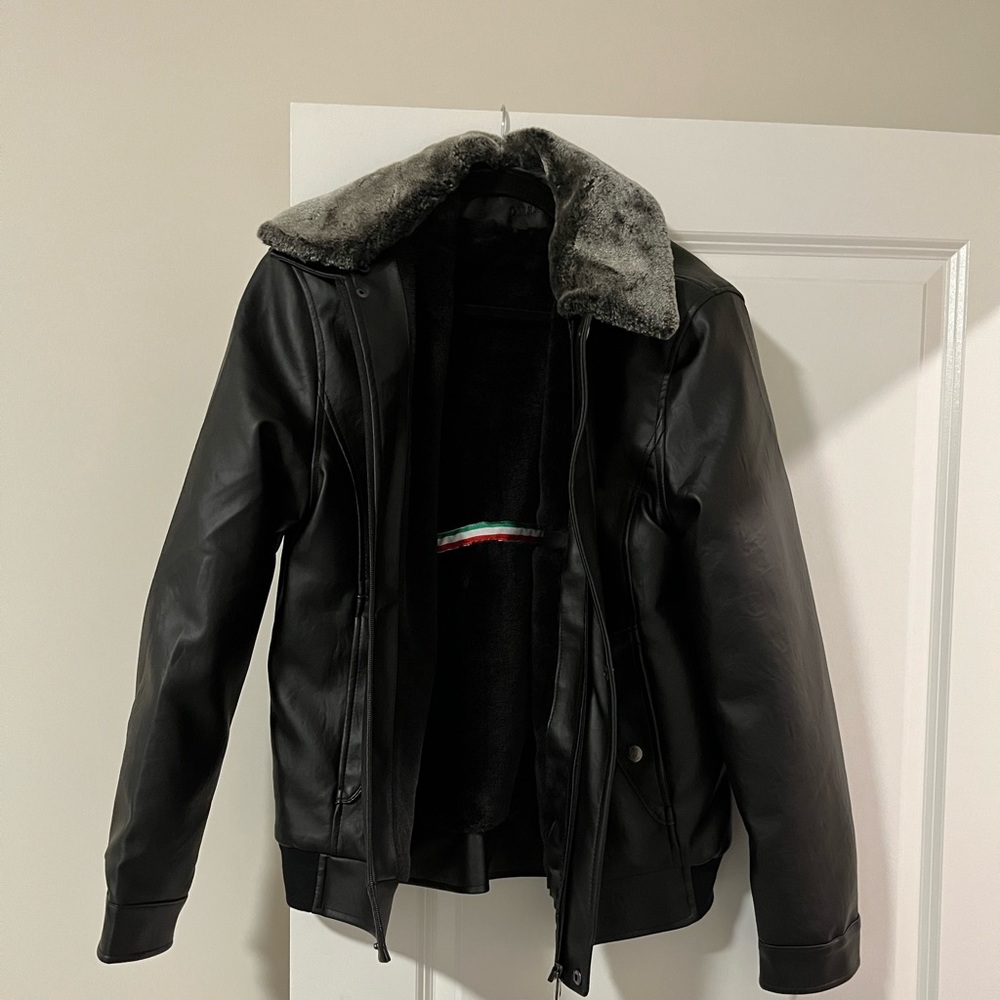 Men’s faux leather jacket. Detachable faux fur neck piece.